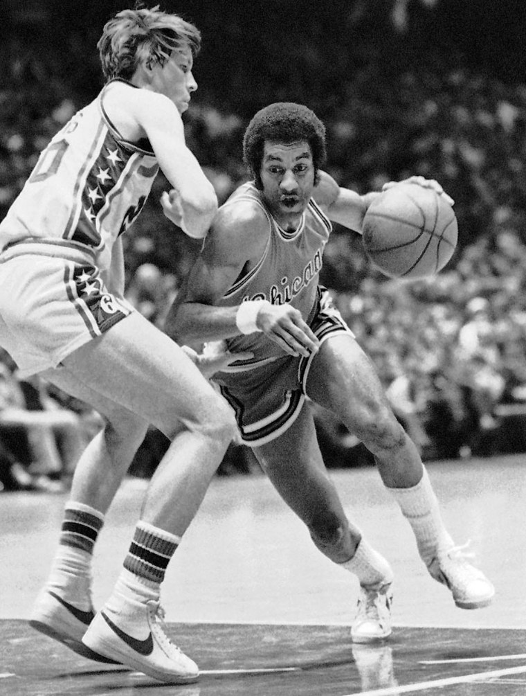 ** FILE ** In this March 17, 1976 file photo, Philadelphia 76ers' Doug Collins, left, defends as Chicago Bulls guard Norm Van Lier dribbles past him during the first half of an NBA basketball game in Philadelphia.  Former NBA basketball player Norm Van Lier died Thursday, Feb. 26, 2009, the Cook County medical examiner's said. He was 61. Chicago Fire Department spokesman Quention Curtis says firefighters responding to a request for a well-being check found Van Lier unresponsive shortly before 1 p.m. He was pronounced dead at the scene. (AP Photo/Rusty Kennedy, File)